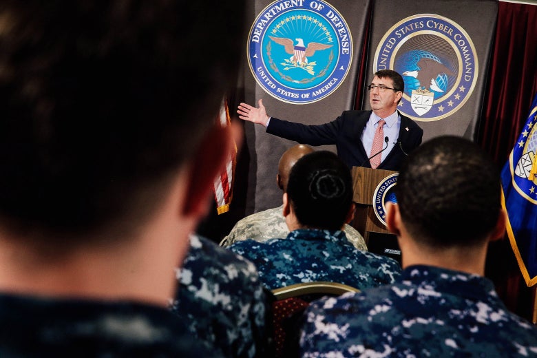 Ash Carter at a podium in front of troops and employees.